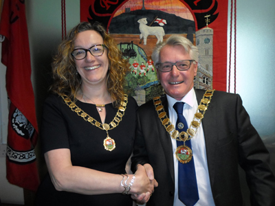 Mayor Henry Biscoe and Deputy Mayor Deborah Reeve shake hands after their election